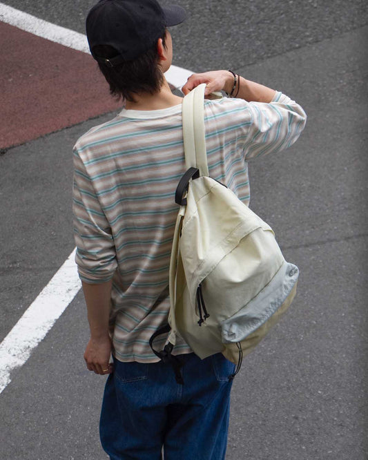AURALEE の BACKPACK MADE BY AETA