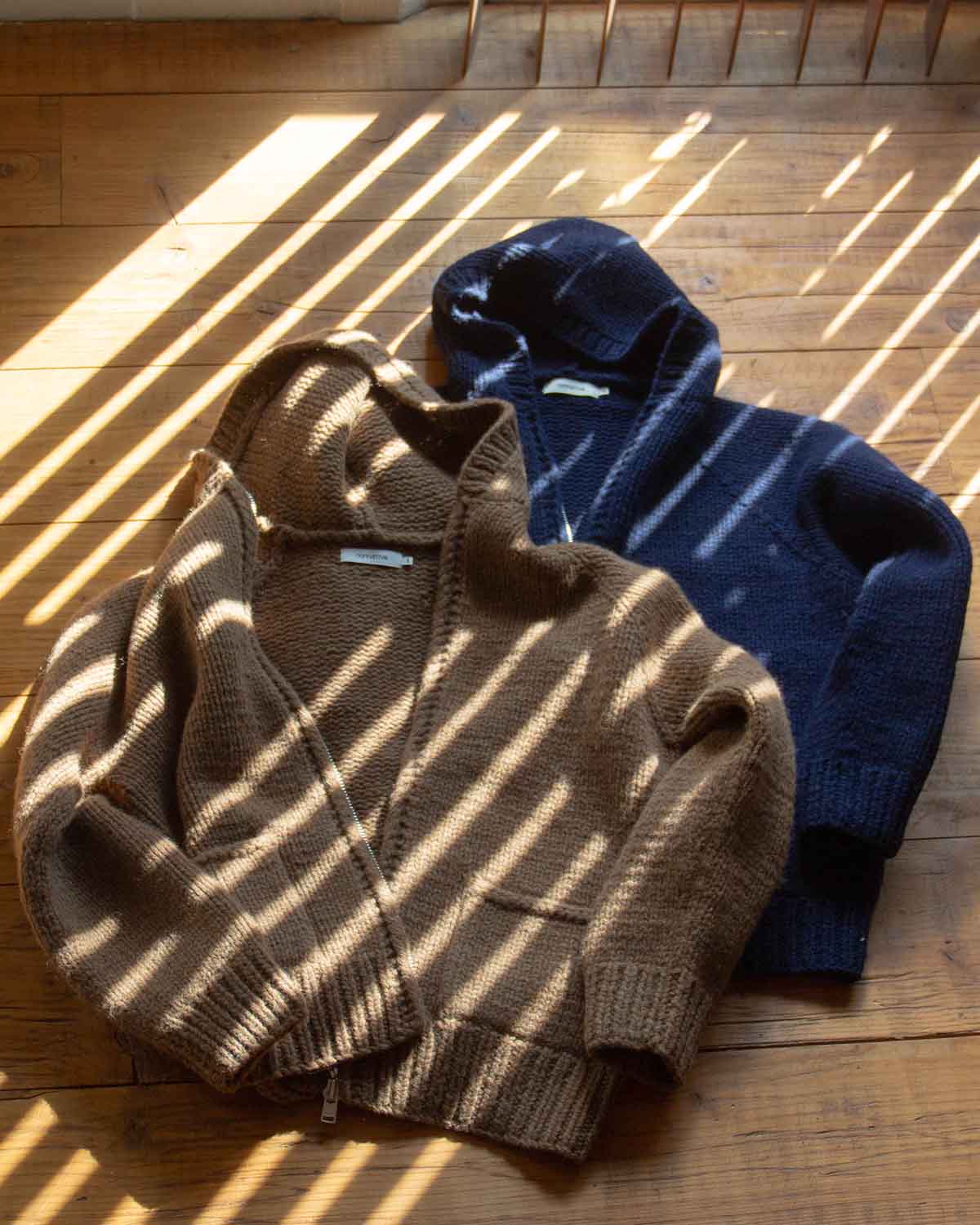 nonnativeのジップアップセーター