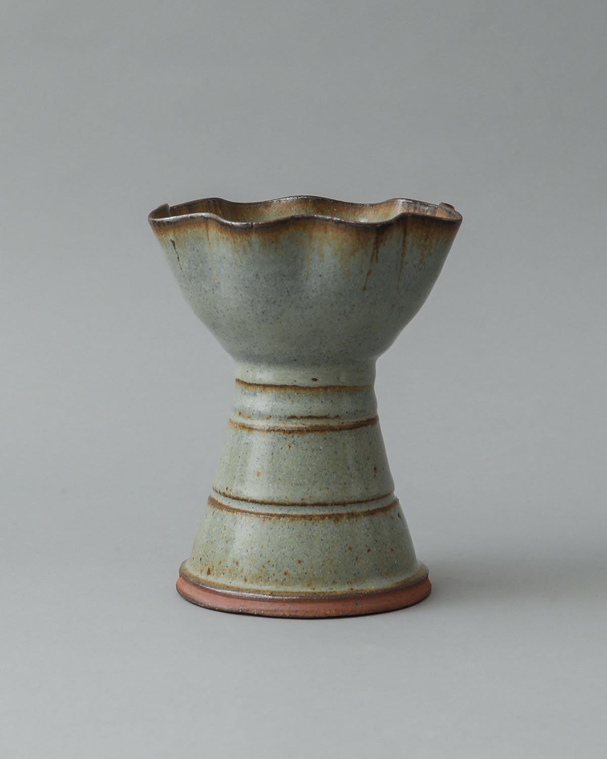 IRREGULAR FLOWER VASE IN LIGHT BLUE GLAZE