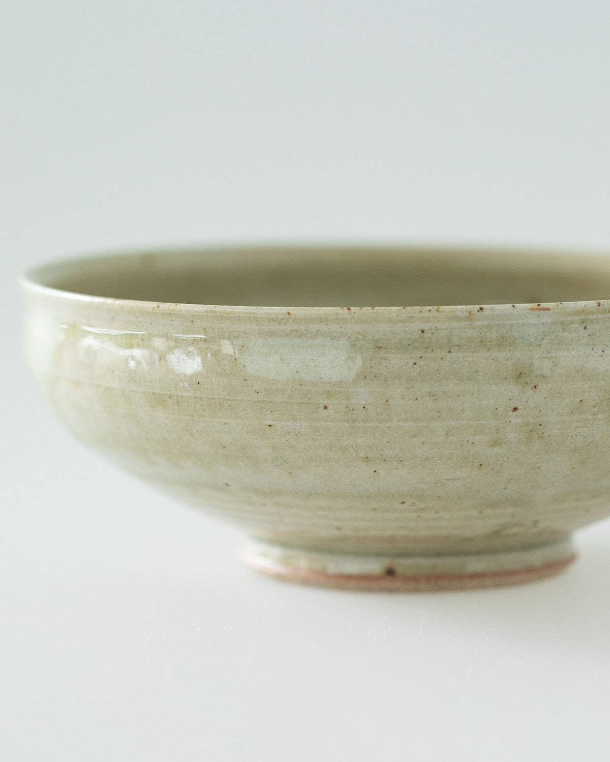 6-SUN ROUND BOWL - PALE GREEN GLAZE