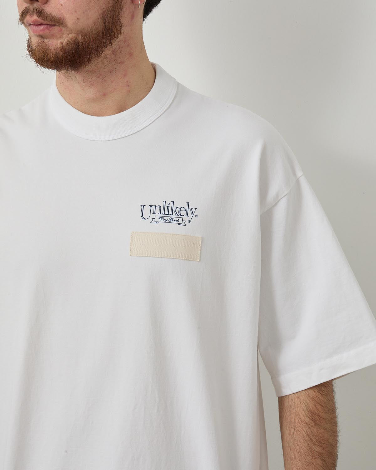 UNLIKELY TEAM TEE