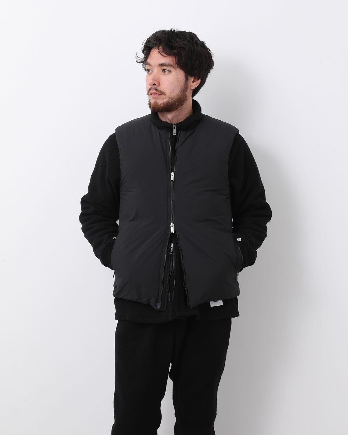 MONK DOWN VEST NYLON TYPEWRITER WITH WINDSTOPPER®