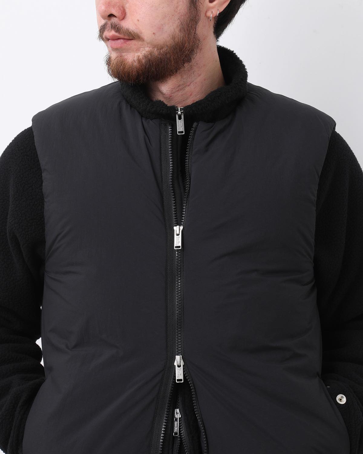 MONK DOWN VEST NYLON TYPEWRITER WITH WINDSTOPPER®