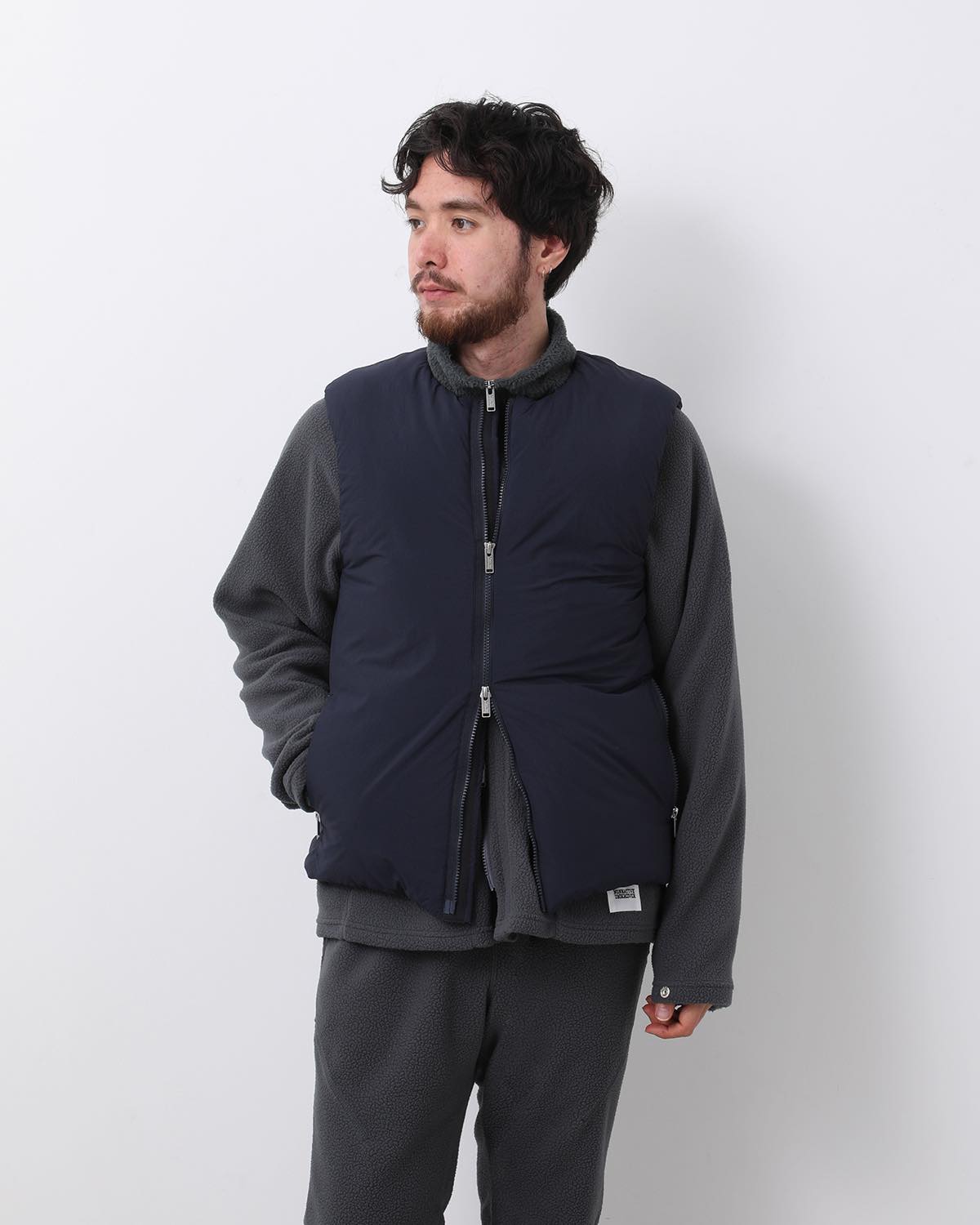 MONK DOWN VEST NYLON TYPEWRITER WITH WINDSTOPPER®