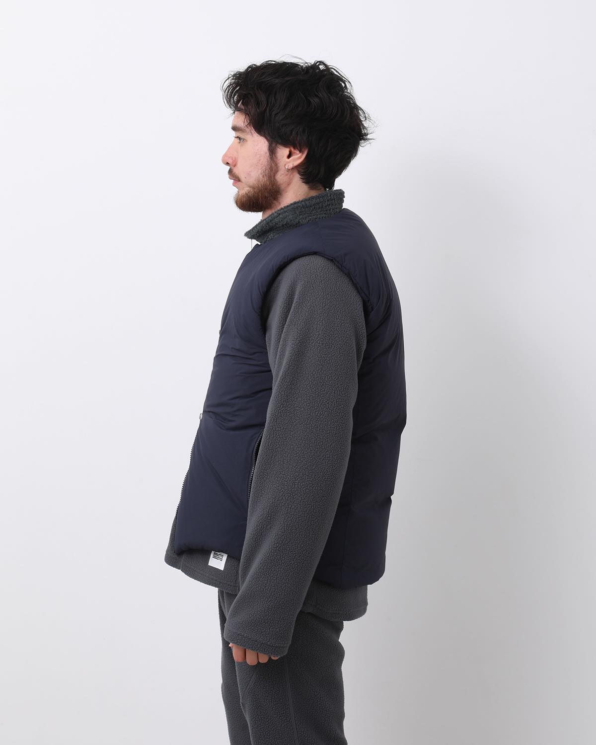 MONK DOWN VEST NYLON TYPEWRITER WITH WINDSTOPPER®