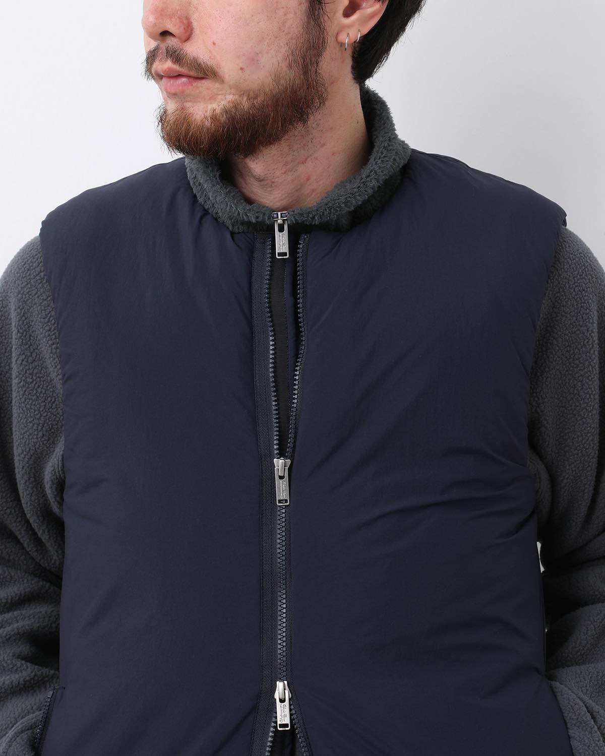 MONK DOWN VEST NYLON TYPEWRITER WITH WINDSTOPPER®