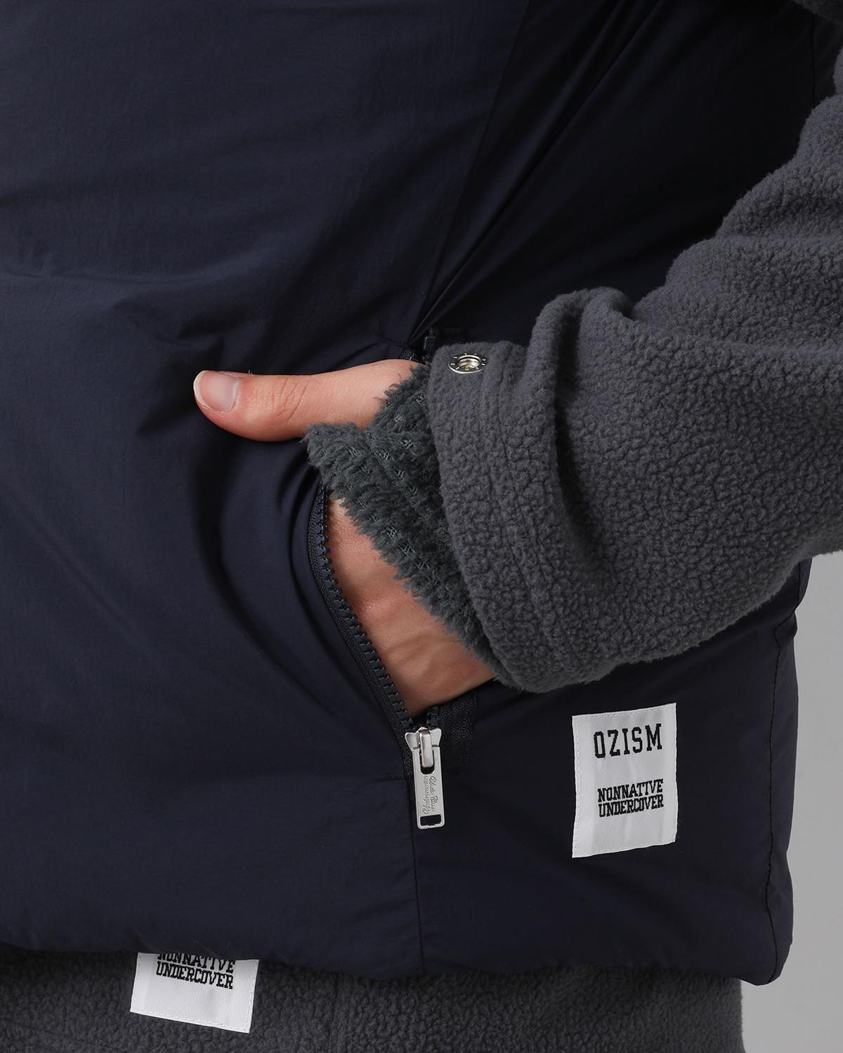 MONK DOWN VEST NYLON TYPEWRITER WITH WINDSTOPPER®